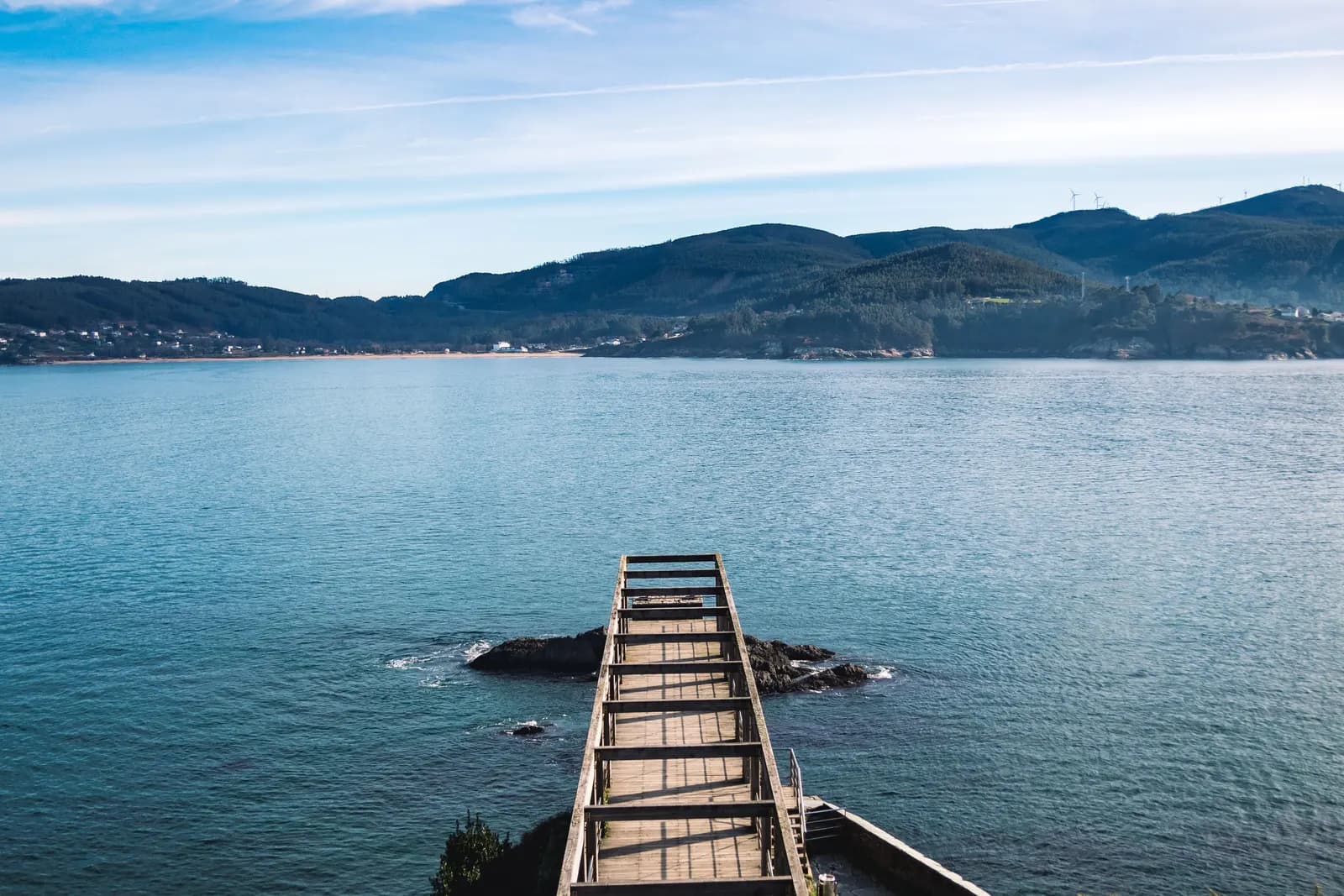 Hills and a quiet jetty on the Sea of Marmara in early morning light